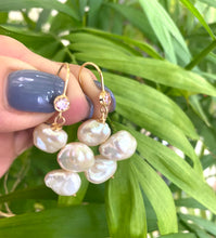 Load image into Gallery viewer, Elegant earrings composed of Natural Keshi pink and white pearls hanging from gold filled hooks with pink cubic zirconia bezel