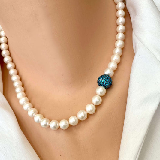 Pearl necklace with turquoise CZ bead, handmade in Canada, showcasing classic elegance and modern color.