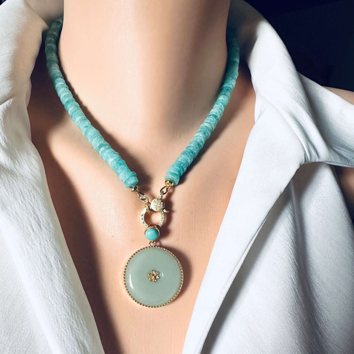 Hotan jade pendant with turquoise accent in gold vermeil on a stylish necklace.