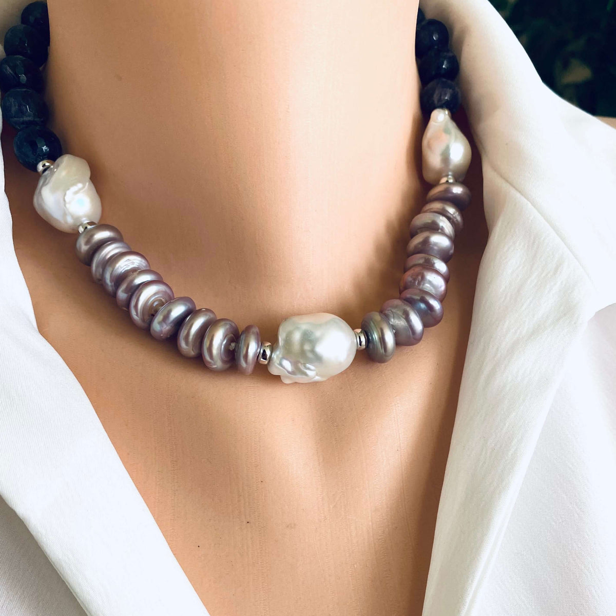 Amethyst pearl necklace featuring baroque and coin pearls, showcasing elegance and bold color in a refined design.