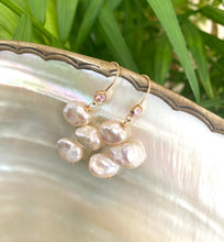 Load image into Gallery viewer, Elegant earrings composed of Natural Keshi pink and white pearls hanging from gold filled hooks with pink cubic zirconia bezel
