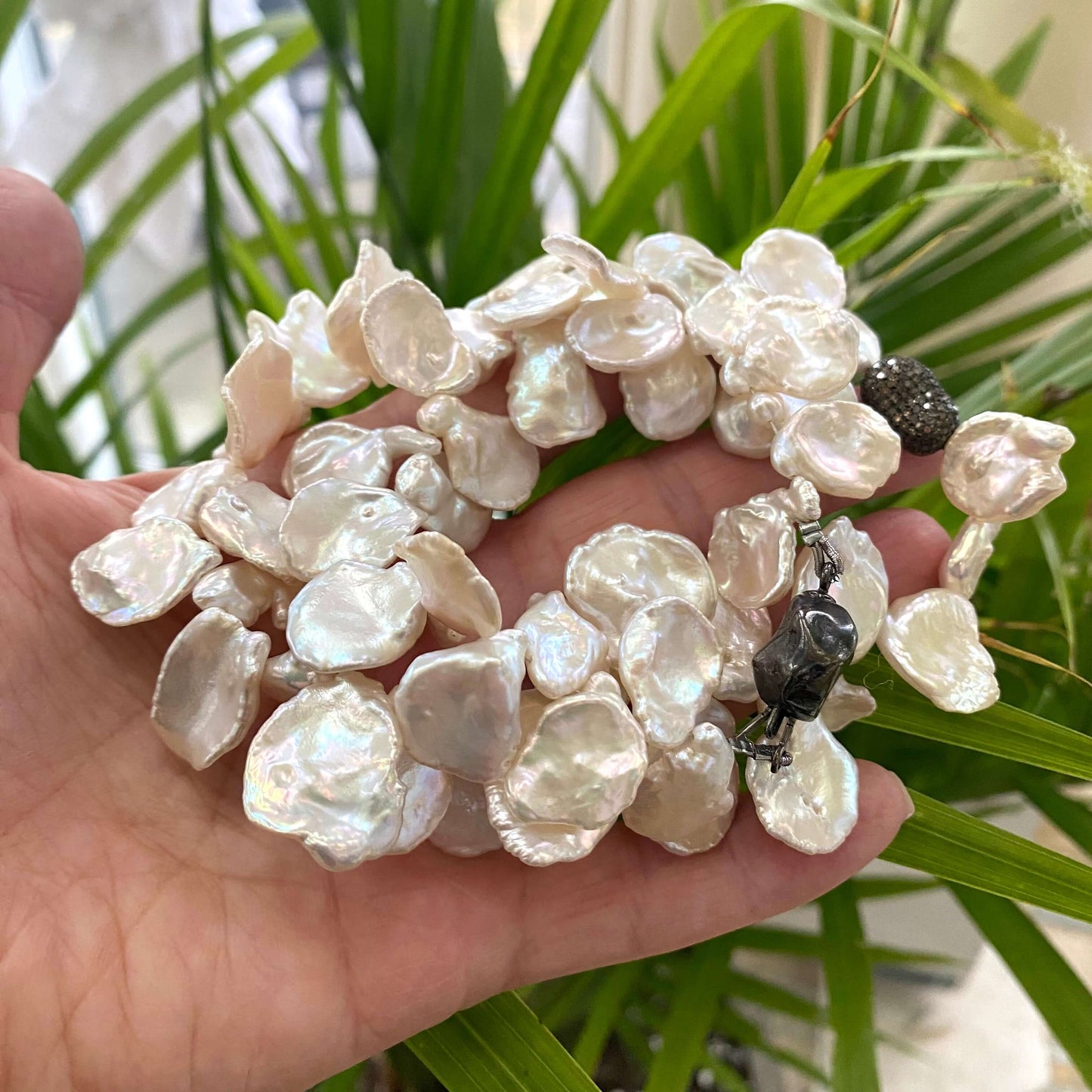 Bridal Petal Pearl Necklace showcasing luminous freshwater keshi pearls and oxidized silver design.
