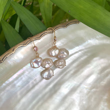 Load image into Gallery viewer, Elegant earrings composed of Natural Keshi pink and white pearls hanging from gold filled hooks with pink cubic zirconia bezel