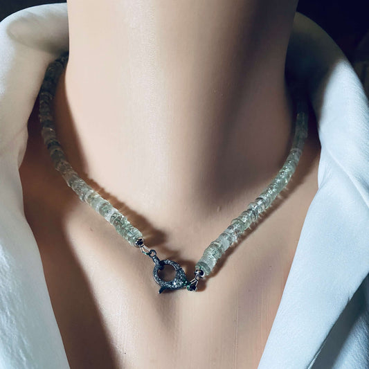 Green amethyst beaded necklace with diamond and emerald pavé clasp displayed on a mannequin.