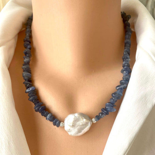 Blue kyanite pearl necklace on mannequin showing baroque pearl centerpiece