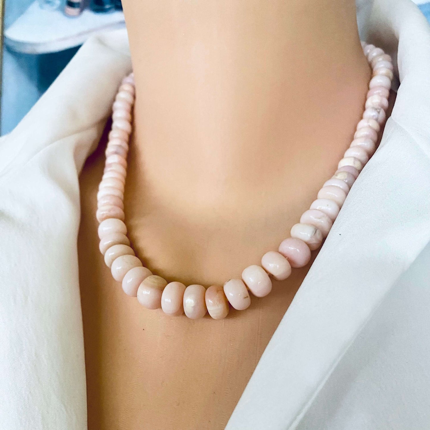 Graduated Pink Opal Necklace Gold worn at neckline, graduated pink opal rondelles with vermeil clasp detail