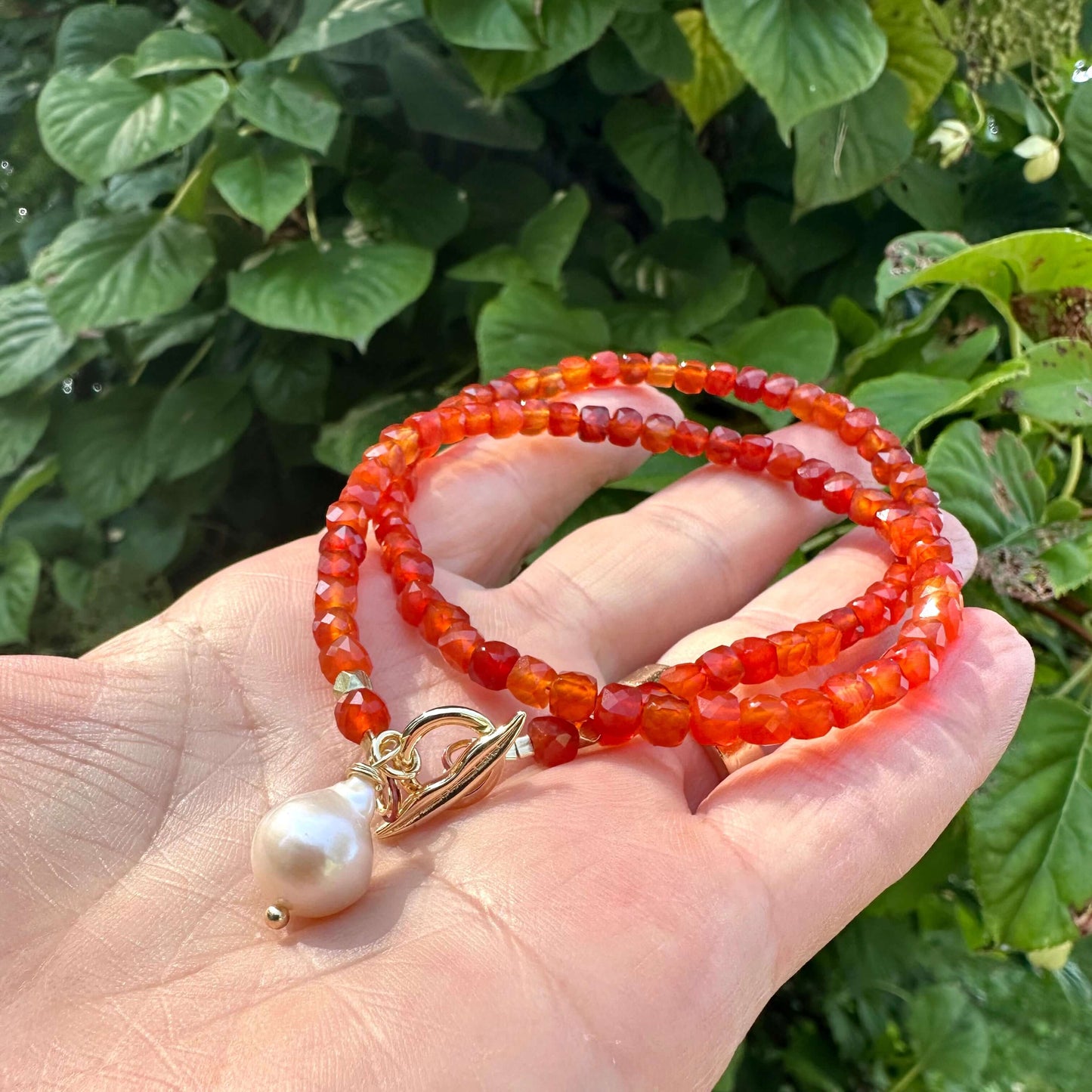 Carnelian toggle necklace with baroque pearl showing gold plated toggle clasp and pearl charm