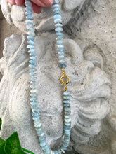 Load image into Gallery viewer, Hand-knotted candy necklace featuring faceted aquamarine rondelle beads with a gold vermeil plated silver marine closure. Available in 18.5 or 21.5 inches, this elegant piece is a perfect March birthstone gift for her.