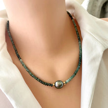 Load image into Gallery viewer, Stunning shaded green Necklace featuring faceted Emerald roundelle beads and a greenish black Tahitian Pearl centerpiece. May birthstone Gift For Her. Crafted with gold filled, the necklace measures 18.5 inches in length
