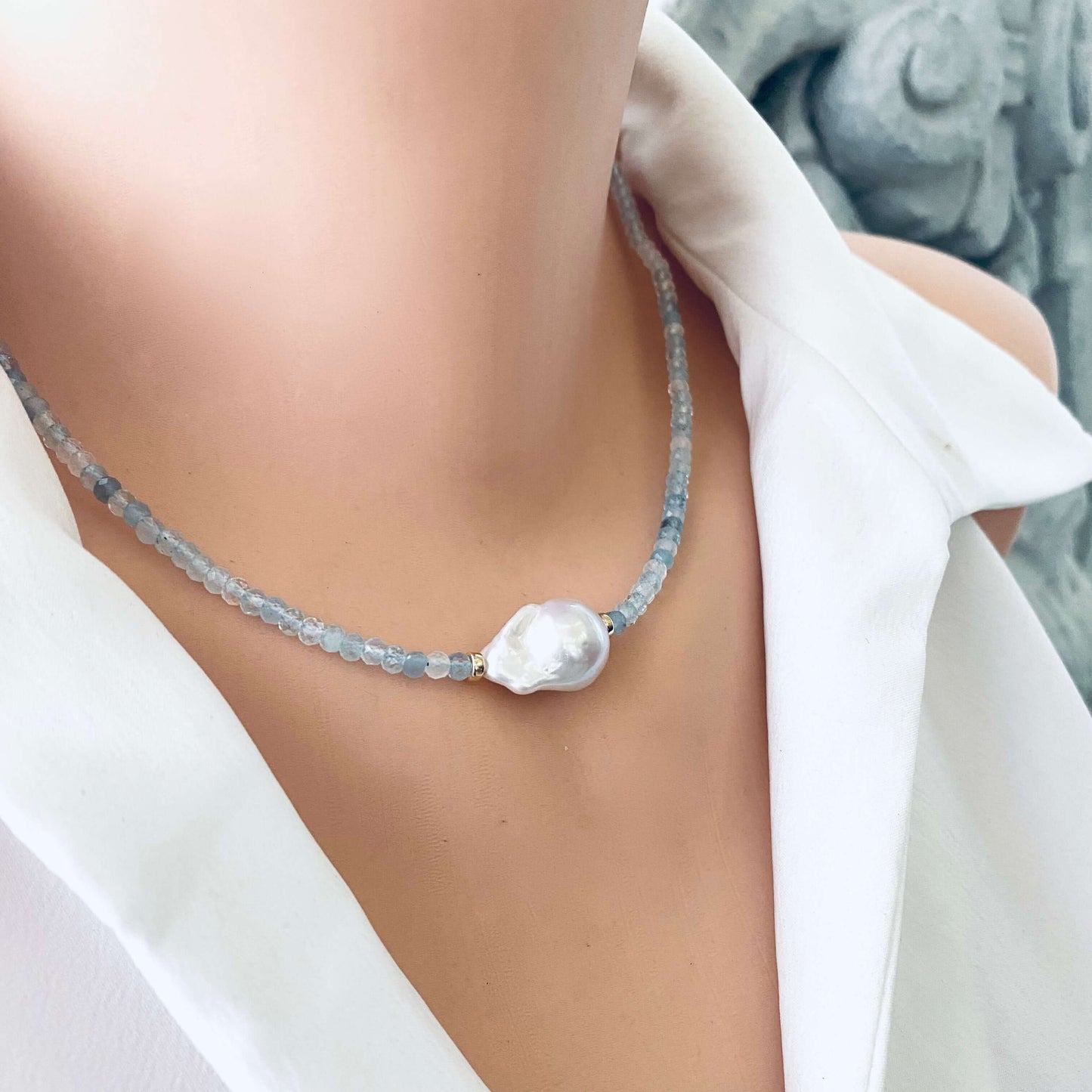 Aquamarine pearl necklace on mannequin, detailed gemstone view