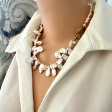 Load image into Gallery viewer, Stunning 19" white Keshi pearls necklace, featuring a unique asymmetrical design that showcases both petal-shaped and nugget pearls with a beautiful golden vine leaf toggle clasp making this necklace not only easy to wear but a striking focal point.