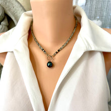 Carica l'immagine nel visualizzatore di Gallery, This necklace features a delicate chain of soft, translucent faceted green Prehnite rondelle beads, beautifully complemented by a striking Tahitian baroque pearl as the centerpiece pending from a cold filled toggle clasp. 18"inches long