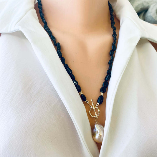 Black tourmaline pearl necklace worn on mannequin, front view