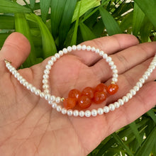 Load image into Gallery viewer, double wrap bracelet, featuring one long strand of lustrous freshwater pearls 4mm accented by stunning deep orange Carnelian Onion briolettes. Gold filled lobster clasp