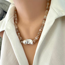 Load image into Gallery viewer, Hand-knotted necklace with mixed moonstone and a baroque pearl at the center, threaded with orange string, 20 inches long, featuring a sterling silver marine clasp.