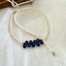 Load image into Gallery viewer, double wrap bracelet, featuring two strands of shimmering freshwater pearls beautifully accented with deep blue Lapis Lazuli teardrop briolettes, Gold filled details.