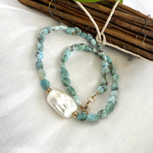 Carica l'immagine nel visualizzatore di Gallery, Fall in love with the soothing blues of Larimar and the timeless elegance of baroque pearls! This necklace features dreamy, ocean-inspired Larimar gemstones nuggets, perfectly complemented by the organic beauty of a stunning baroque pearl, 18 inches