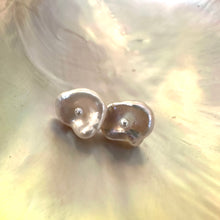 Load image into Gallery viewer, White Keshi pearl stud earrings with a petal shape and a tiny pearl in the center, resembling flowers, set in gold vermeil-plated silver.