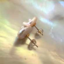 Load image into Gallery viewer, White Keshi pearl stud earrings with a petal shape and a tiny pearl in the center, resembling flowers, set in gold vermeil-plated silver.