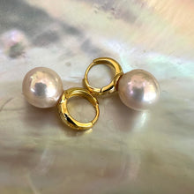 Load image into Gallery viewer, Light golden pink Edison pearl drop earrings with 13mm pearls on gold vermeil-plated silver huggie hoops, perfect for a June birthday or elegant gift.