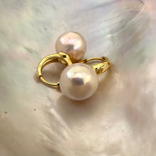 Load image into Gallery viewer, Light golden pink Edison pearl drop earrings with 13mm pearls on gold vermeil-plated silver huggie hoops, perfect for a June birthday or elegant gift.