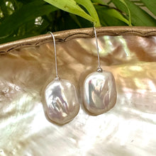Carica l'immagine nel visualizzatore di Gallery, White freshwater pearl drop earrings rhodium-plated silver displayed on pearl shell with green leaf background, designed and handmade in Canada.