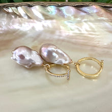 Load image into Gallery viewer, Pink baroque pearl hoop earrings resting on white pearl shell, designed and handmade in Canada.