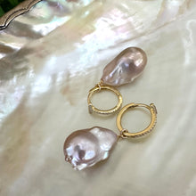 Load image into Gallery viewer, Pink baroque pearl hoop earrings displayed on pearl shell backdrop, CZ pavé gold vermeil hoops handmade in Canada.