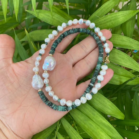 Emerald baroque pearl necklace featuring asymmetric design with Emerald gemstones and organic freshwater pearls.