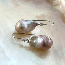 Carica l'immagine nel visualizzatore di Gallery, Lavender Baroque Pearl Earrings – detailed close-up on white pearl shell backdrop