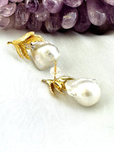 Load image into Gallery viewer, Baroque Pearl Earrings with gold vermeil oak leaf accents displayed beside raw amethyst gemstone on white backdrop.