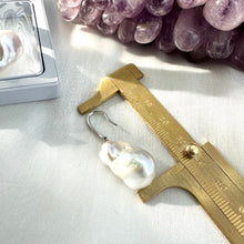 Load image into Gallery viewer, White baroque pearl bridal earrings measured for full drop length on white cloth, designed and handmade in Canada.