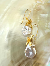 Load image into Gallery viewer, Close-up of Keshi Pearl Earrings with white petal pearls displayed on white pearl shell background.
