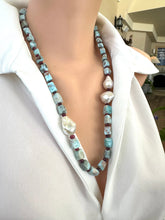 Load image into Gallery viewer, Handmade larimar ruby and baroque pearl necklace on mannequin side view, silver clasp visible