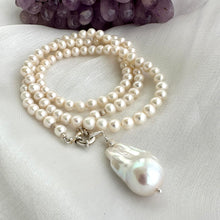Load image into Gallery viewer, Close-up of white pearl necklace with baroque pendant on white background