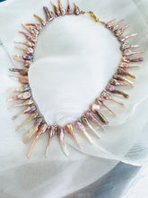 Load image into Gallery viewer, Pink Biwa pearl necklace displayed on soft white fabric background, handmade jewelry