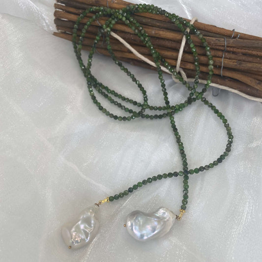 Green diopside lariat necklace with Baroque pearls showcasing vibrant green gemstones and elegant freshwater details.