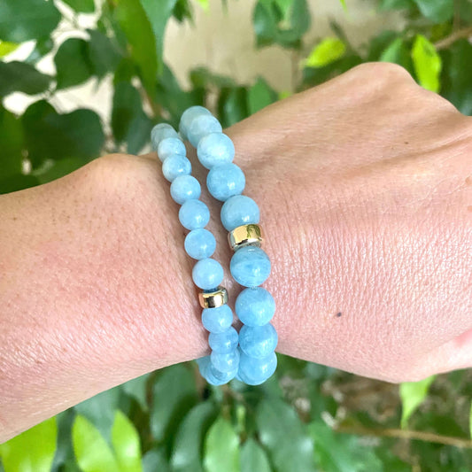 Aquamarine stretch bracelet featuring 6mm and 8mm AAA Aquamarine beads with 14K gold filled accents.
