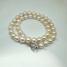 Load image into Gallery viewer, White pearl necklace cross pendant photographed on white backdrop — handcrafted classic pearl jewelry by Loulia Pearl Jewelry