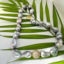 Load image into Gallery viewer, Handmade silver grey baroque pearl necklace detail on green leaf backdrop