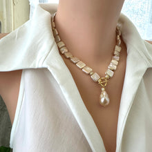 Load image into Gallery viewer, Side angle of golden baroque pearl toggle necklace on mannequin — elegant handcrafted pearl jewelry with gold clasp by Loulia Pearl Jewelry