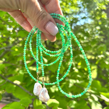 Load image into Gallery viewer, Apple Green Chrysoprase Lariat Necklace held against green leaves — natural gemstone and pearl lariat handcrafted by Loulia Pearl Jewelry