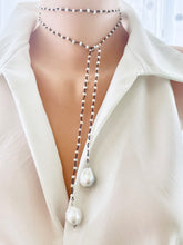 Load image into Gallery viewer, Versatile 40-inch Pearl Lariat Rosary Chain, designed with a stunning black rhodium-plated silver chain and freshwater small pearls for a modern, sophisticated look. Each end of the lariat features a unique white baroque pearl
