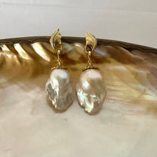 Load image into Gallery viewer, Leaf Design Pearl Earrings with gold vermeil accents and baroque pearl drops on a decorative plate.