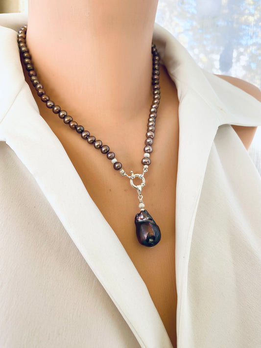 Bronze pearl necklace featuring removable brown baroque pearl pendant, displayed on mannequin with natural luster and sheen.