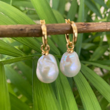 Carica l'immagine nel visualizzatore di Gallery, White Baroque Pearl Earrings – detailed close-up on green foliage backdrop
