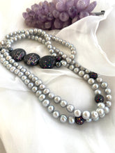 Load image into Gallery viewer, Double-strand Grey Pearl Necklace showcasing freshwater pearls and CZ embellishments beside amethyst on white cloth.