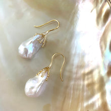 Load image into Gallery viewer, Side angle of white baroque pearl drop earrings showing organic shape and iridescence – handmade in Canada
