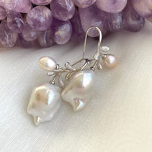 Load image into Gallery viewer, Handmade baroque pearl earrings in silver resting on white and amethyst background