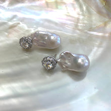 Load image into Gallery viewer, Moissanite and baroque pearl earrings close-up on white pearl shell, handcrafted in Canada.